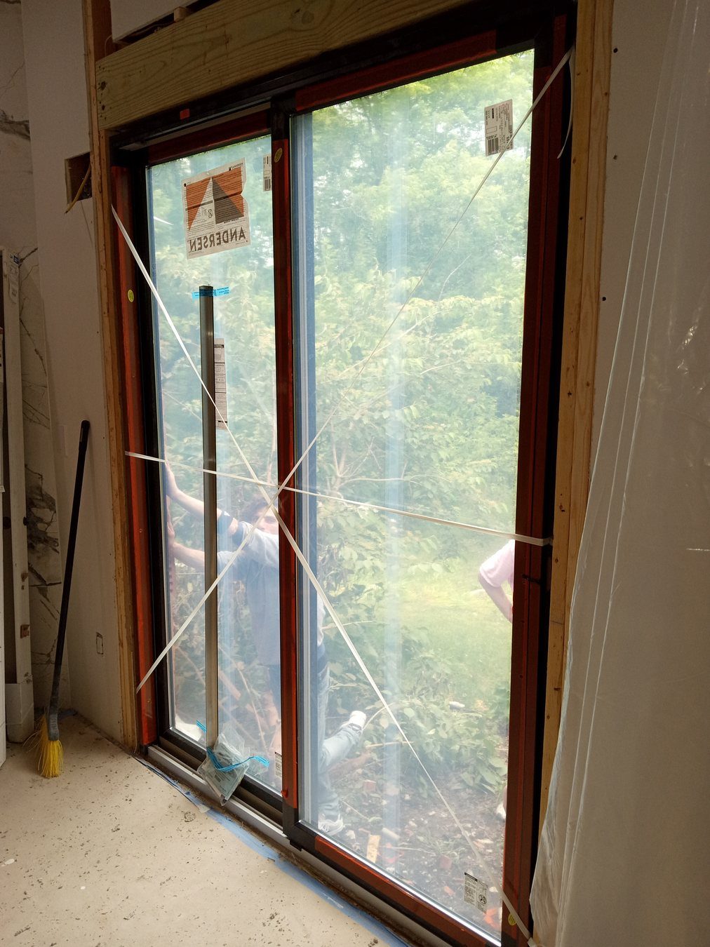 Sliding door area prepared for trim and hardware detail work.