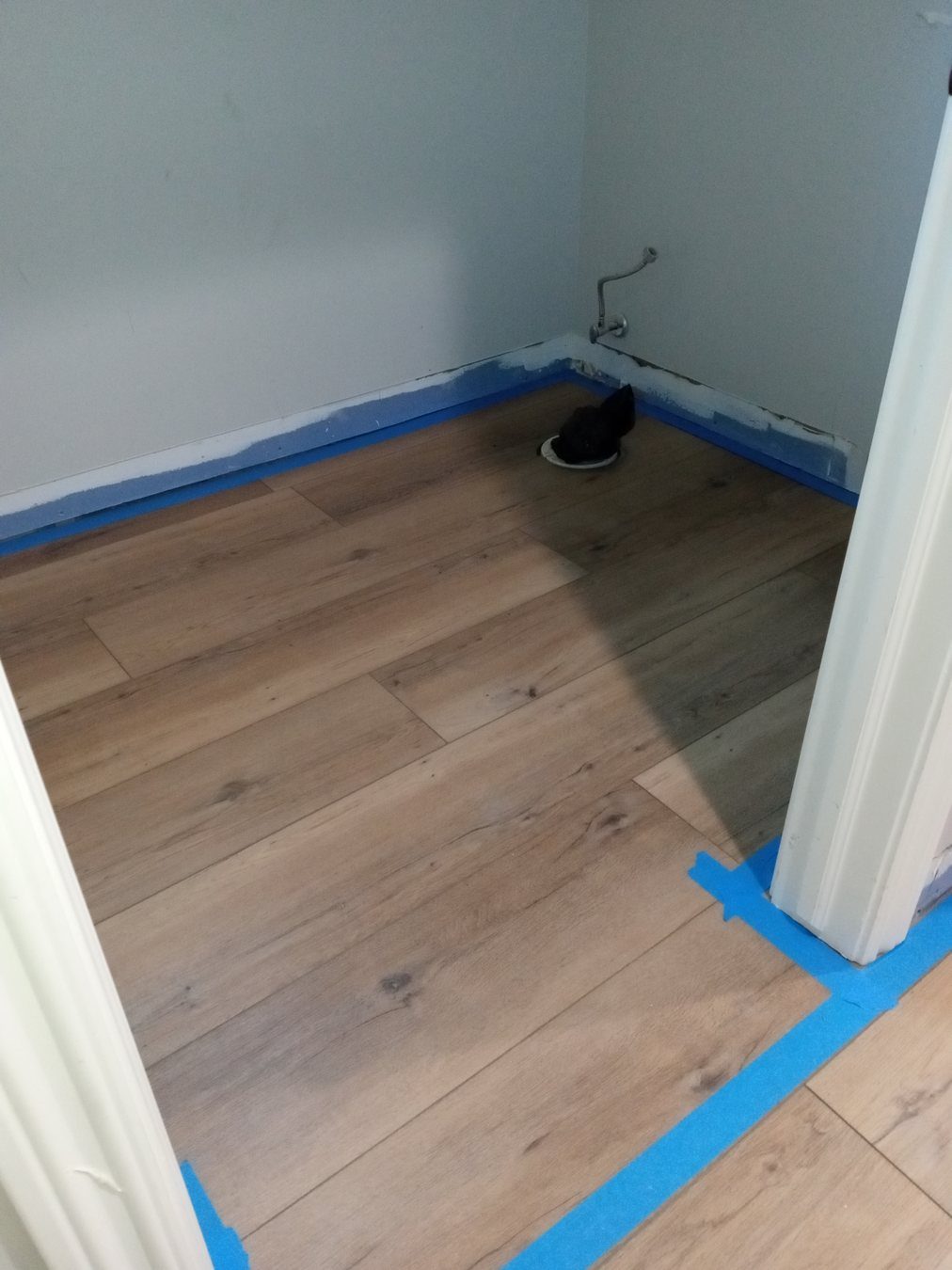Floor and wall detail work prepared for punch-list completion.